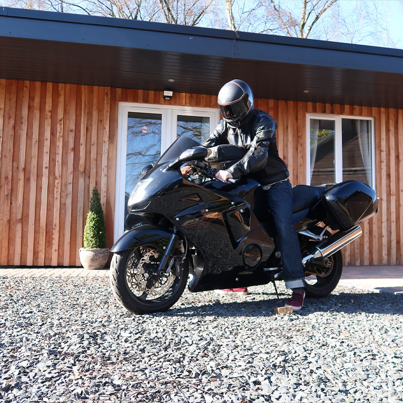 motorbike parked outside a cabin in Scotland